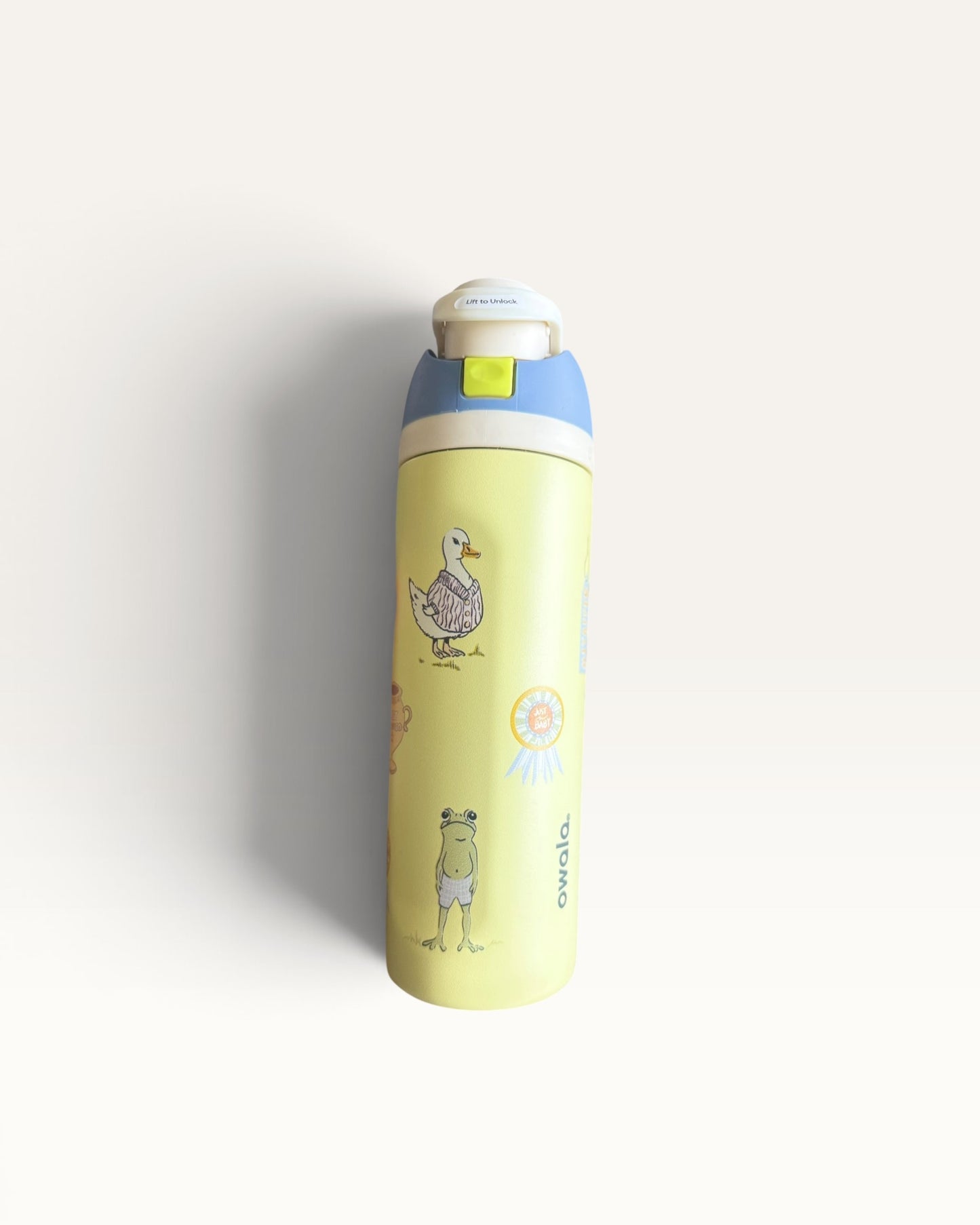 TERMO 24 OZ AMARILLO CON STICKERS
