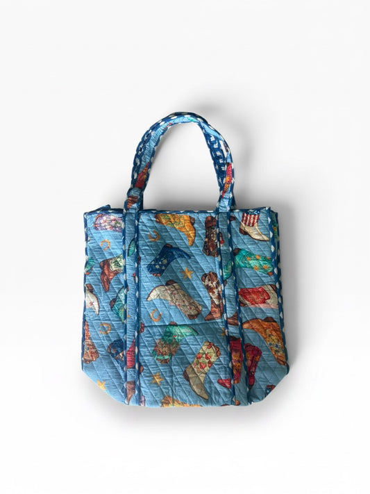 Tote azul con botas vaqueras