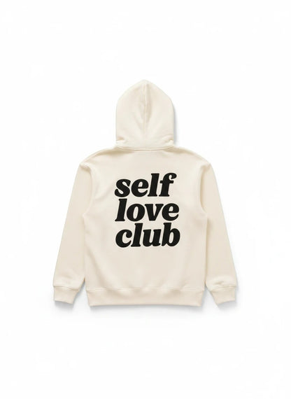 Sudadera beige con capucha de Gifting.mx con el texto Self Love Club en negro en la espalda